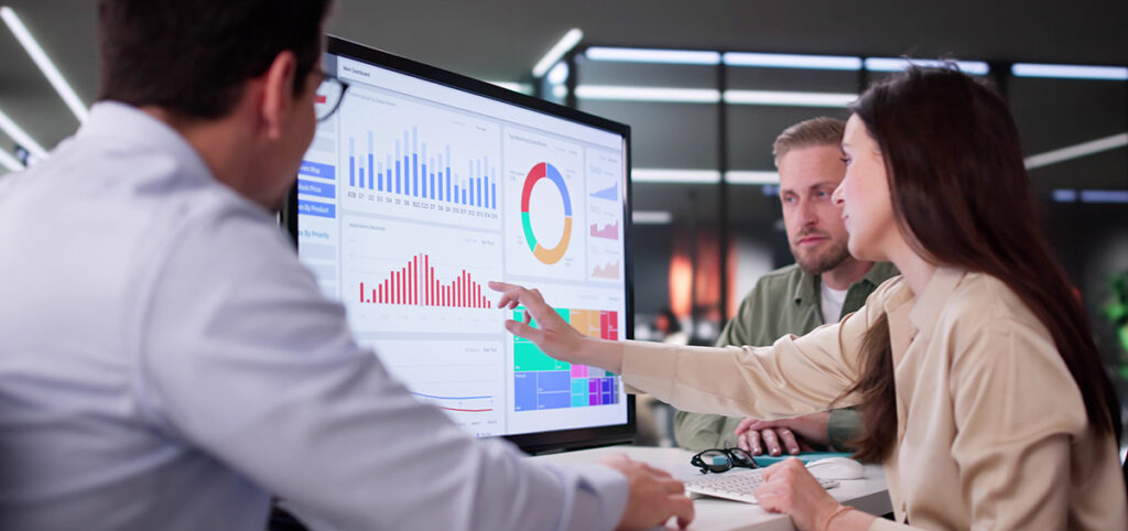 Businesswoman Managing Company Data Using Analytics Dashboard